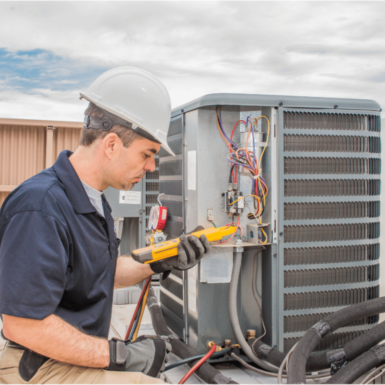 Port Dover Heating & Cooling HVAC technician servicing a system