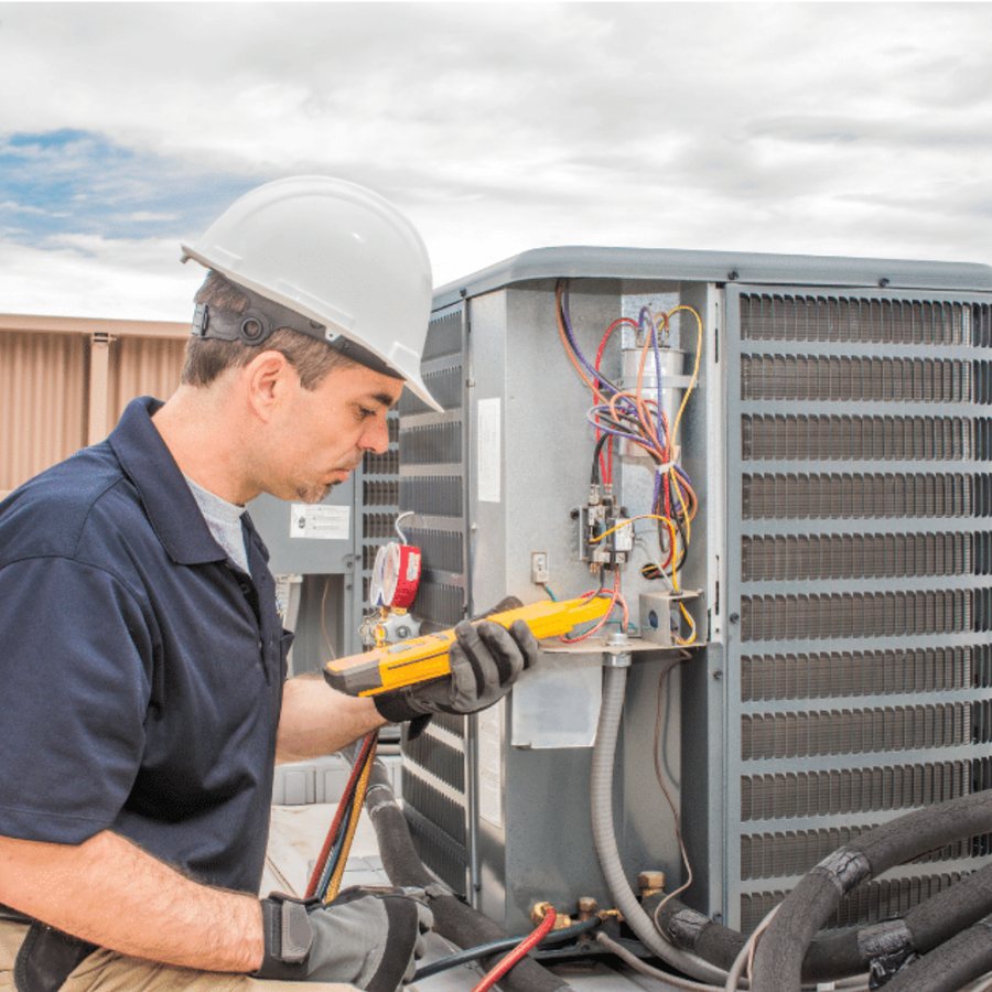 Port Dover Heating & Cooling HVAC technician servicing a system